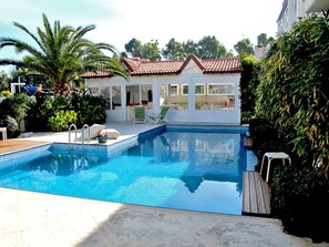 Seasonal outdoor pool, pool umbrellas, pool loungers