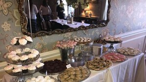 A buffet table with various desserts and pastries. - Camelot Restaurant & Inn (Clarks Summit)