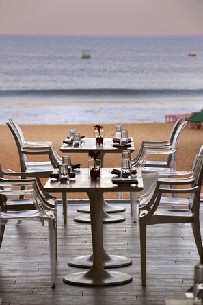 On the beach, sun-loungers, beach umbrellas, beach towels