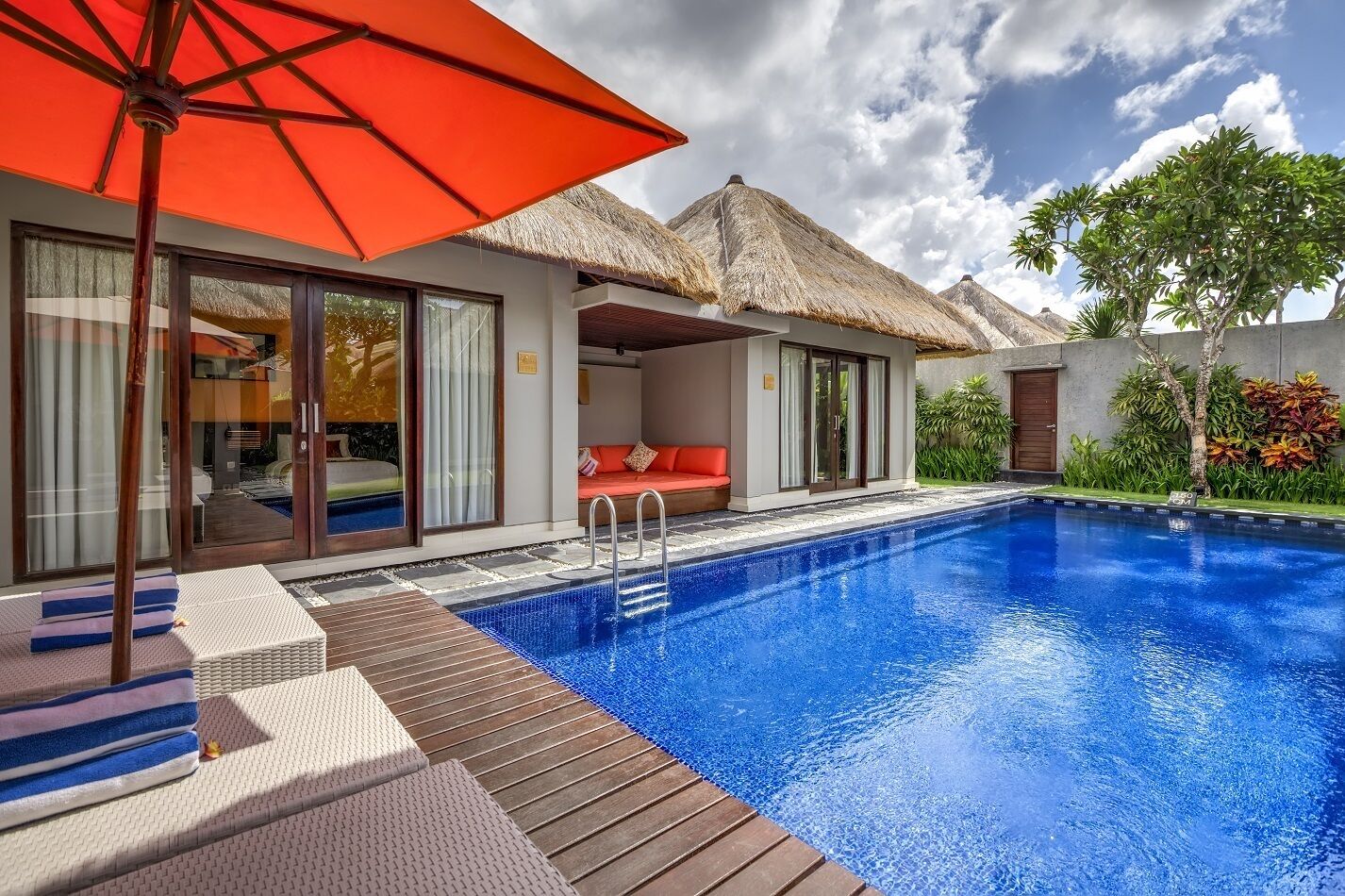 Outdoor pool, pool umbrellas, sun loungers
