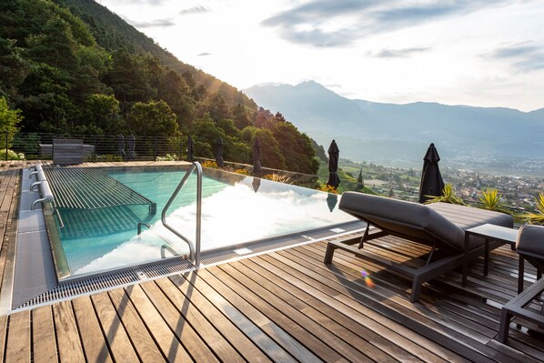 Indoor pool, 2 outdoor pools, open 7:30 AM to 8 PM, pool umbrellas