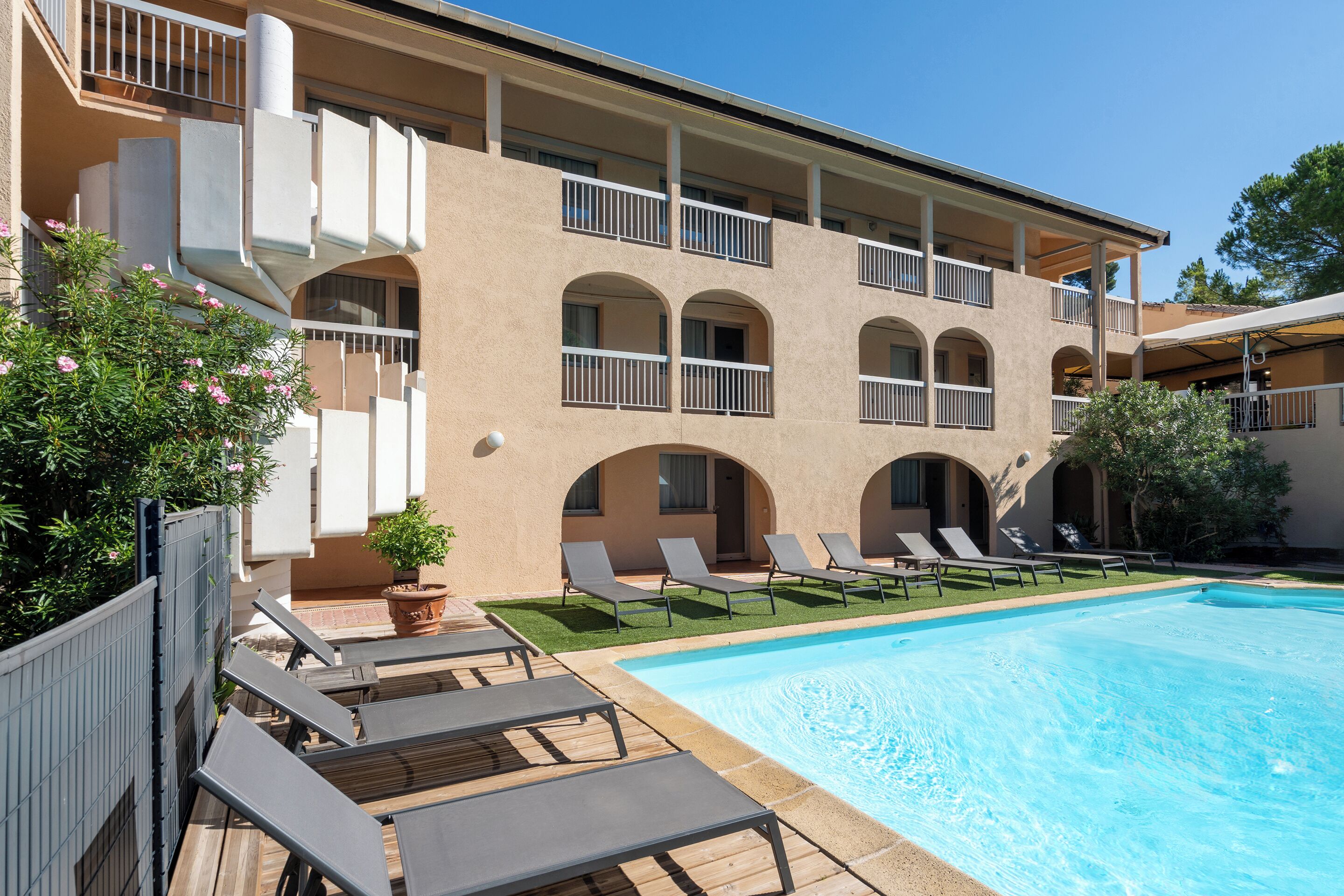 Seasonal outdoor pool, open 9:00 AM to 9:00 PM, pool umbrellas