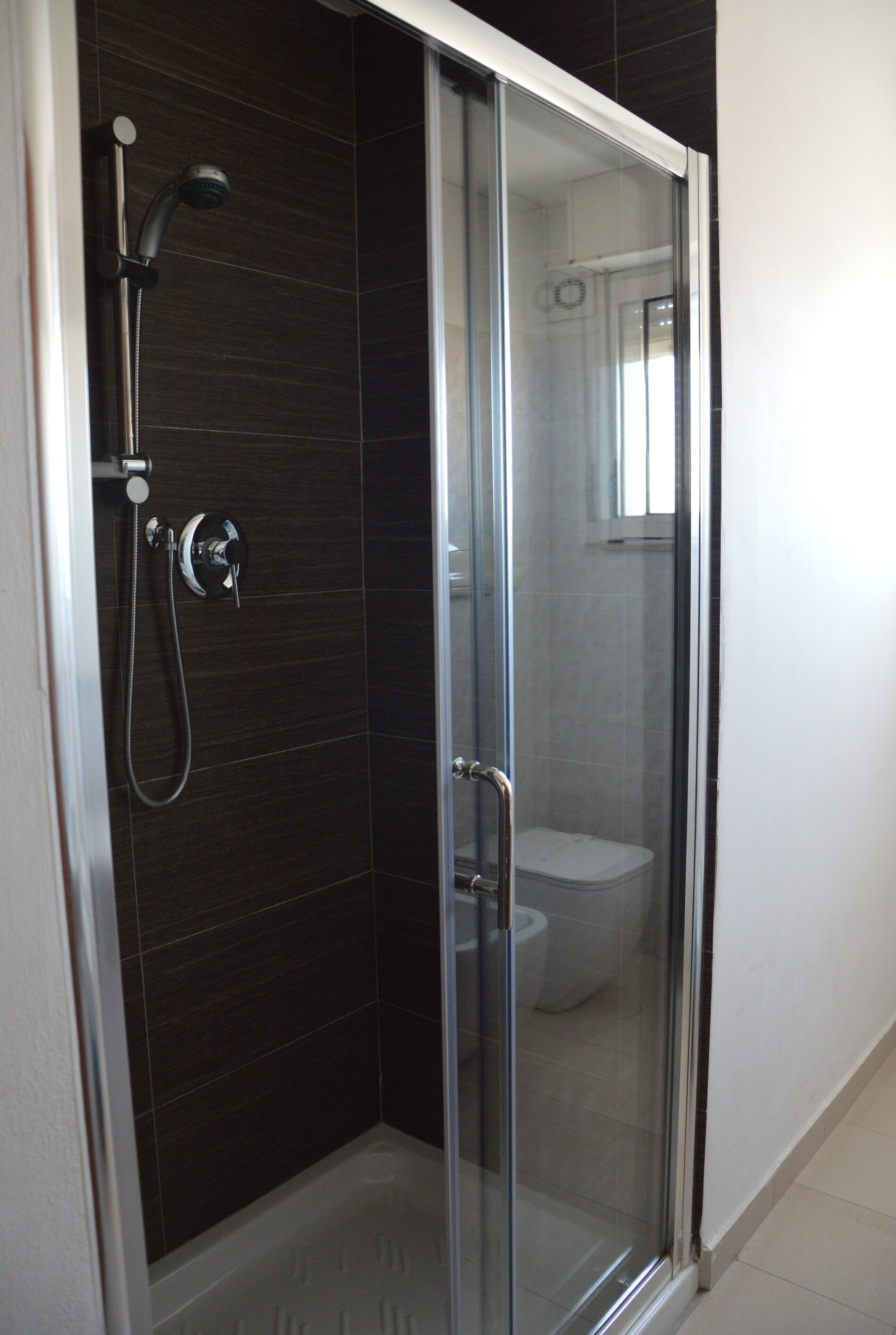 family room | bathroom | shower, hair dryer, bidet, towels