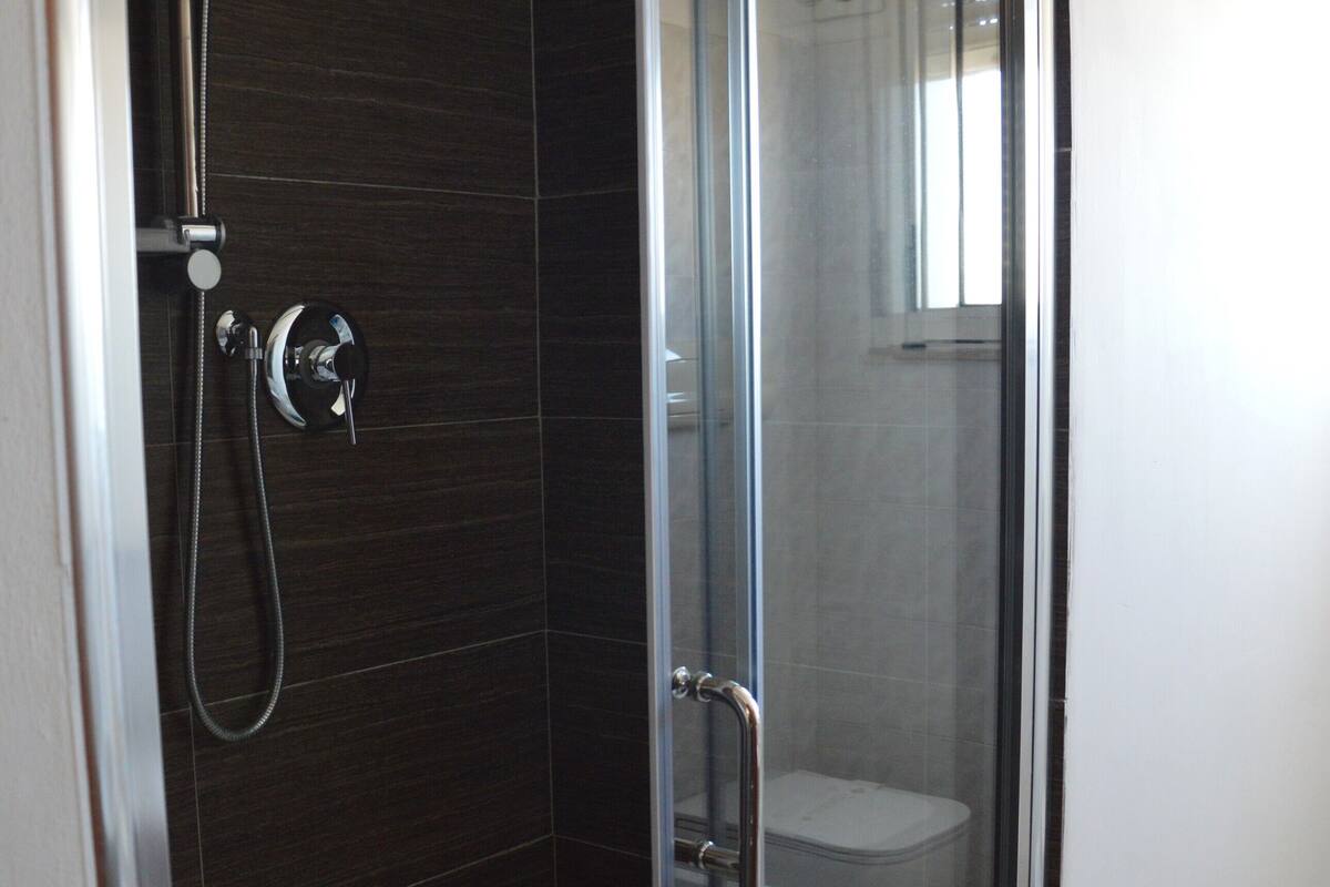 family room | bathroom | shower, hair dryer, bidet, towels