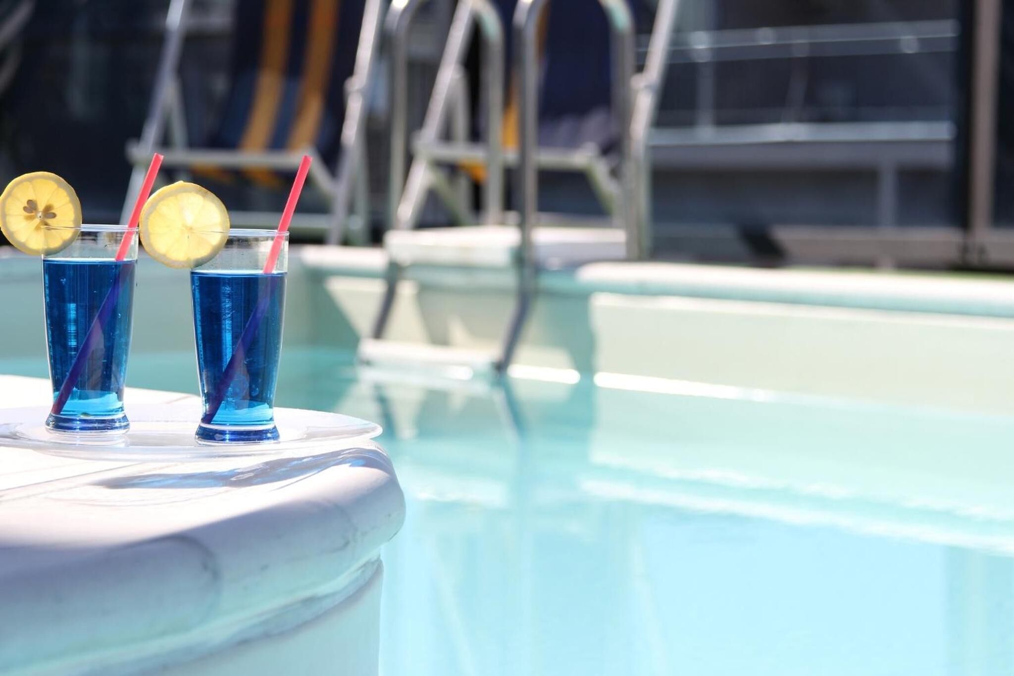 Seasonal outdoor pool, open 9:00 AM to noon, pool umbrellas