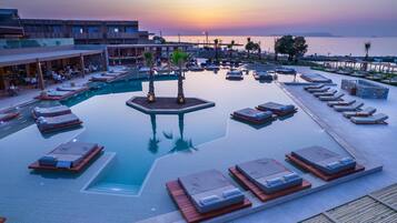 Outdoor pool, open 10:00 AM to 6:00 PM, pool umbrellas, pool loungers