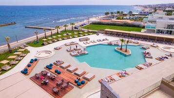 Outdoor pool, open 10:00 AM to 6:00 PM, pool umbrellas, pool loungers