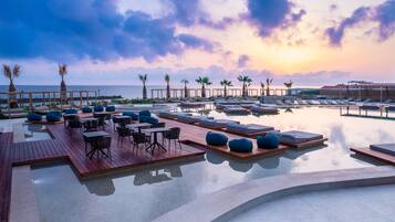 Outdoor pool, open 10:00 AM to 6:00 PM, pool umbrellas, sun loungers