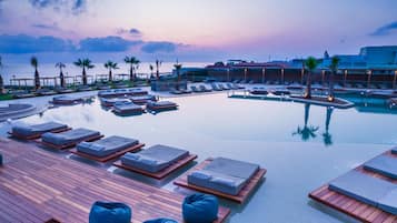 Outdoor pool, open 10:00 AM to 6:00 PM, pool umbrellas, sun loungers