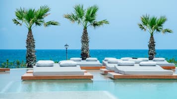 Outdoor pool, open 10:00 AM to 6:00 PM, pool umbrellas, sun loungers