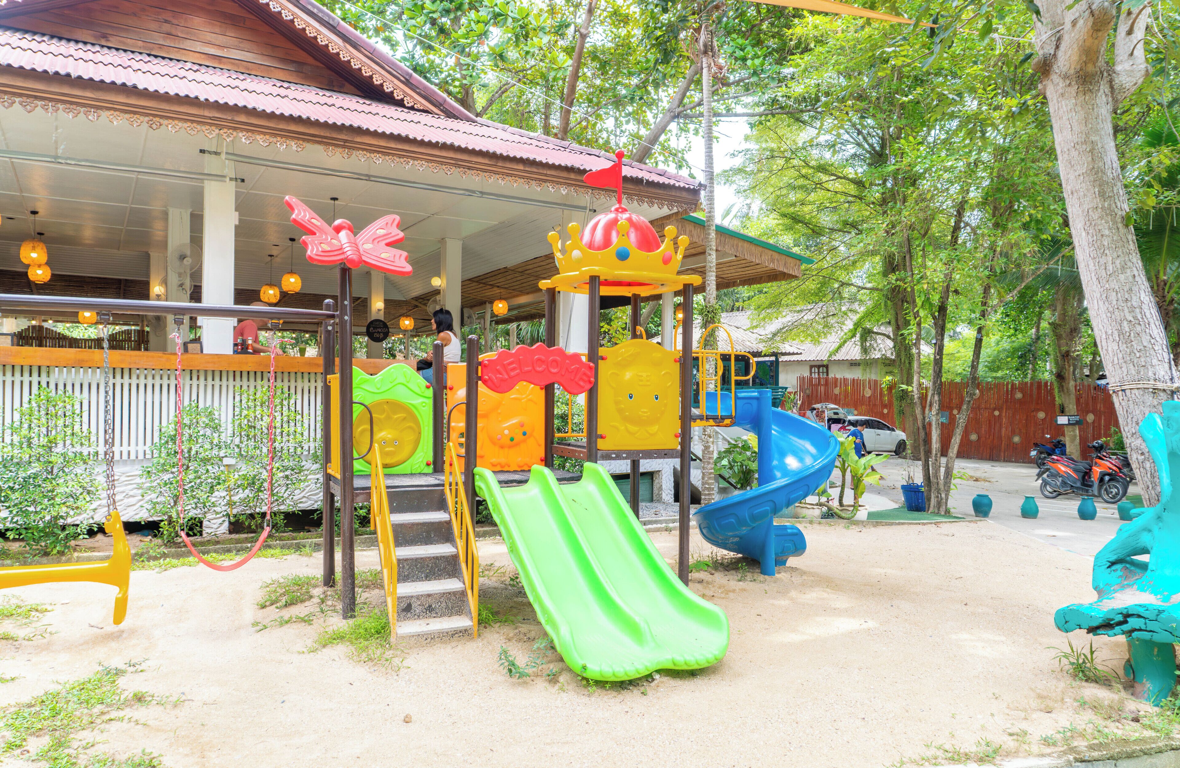 A playground with slides and a play structure.