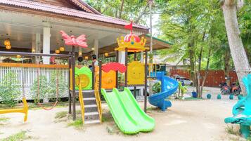 A playground with slides and a play structure.