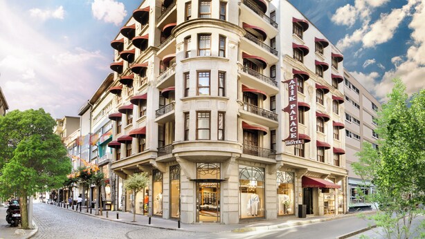 A multi-story hotel with a curved facade, multiple balconies, and large windows. - Atik Palace Hotel (Istanbul)