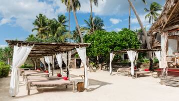 On the beach, sun loungers, beach umbrellas, beach towels