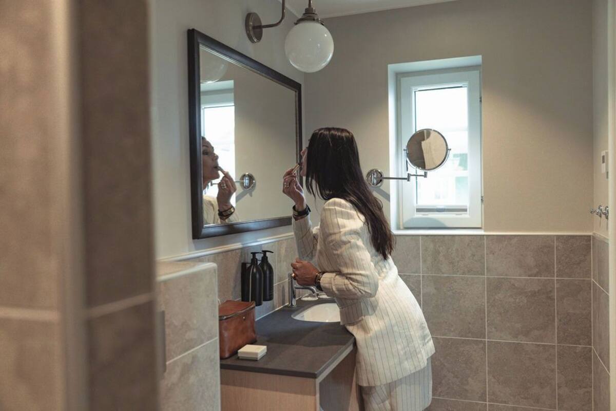 deluxe double room | bathroom | shower, hair dryer, towels, soap