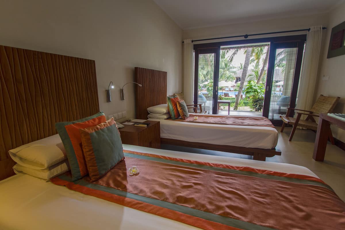 double or twin room, pool view | minibar, in-room safe, desk, blackout curtains