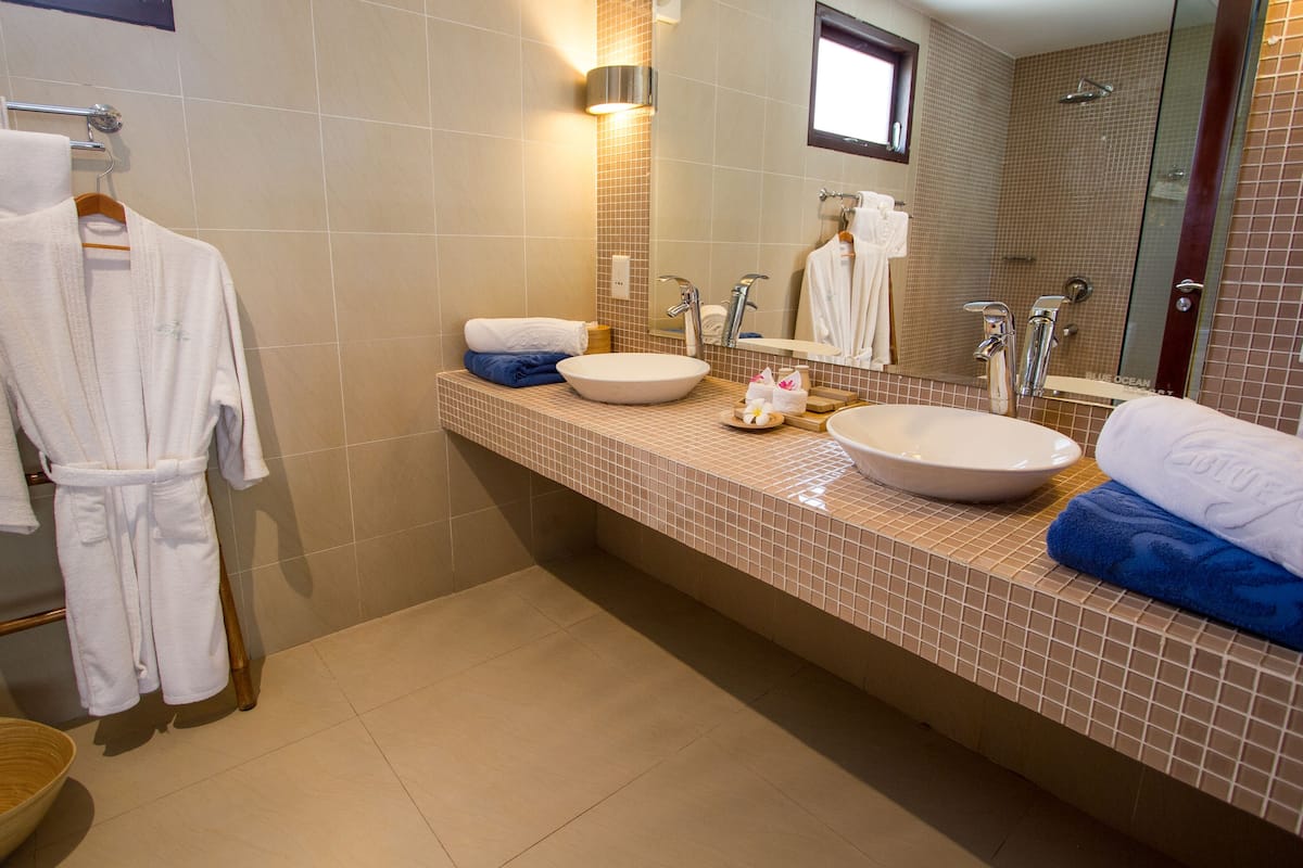 double or twin room, garden view | bathroom | separate bathtub and shower, rainfall showerhead, free toiletries