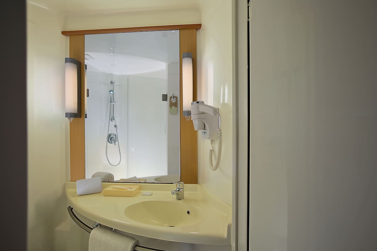 Shower, eco-friendly toiletries, hair dryer, slippers