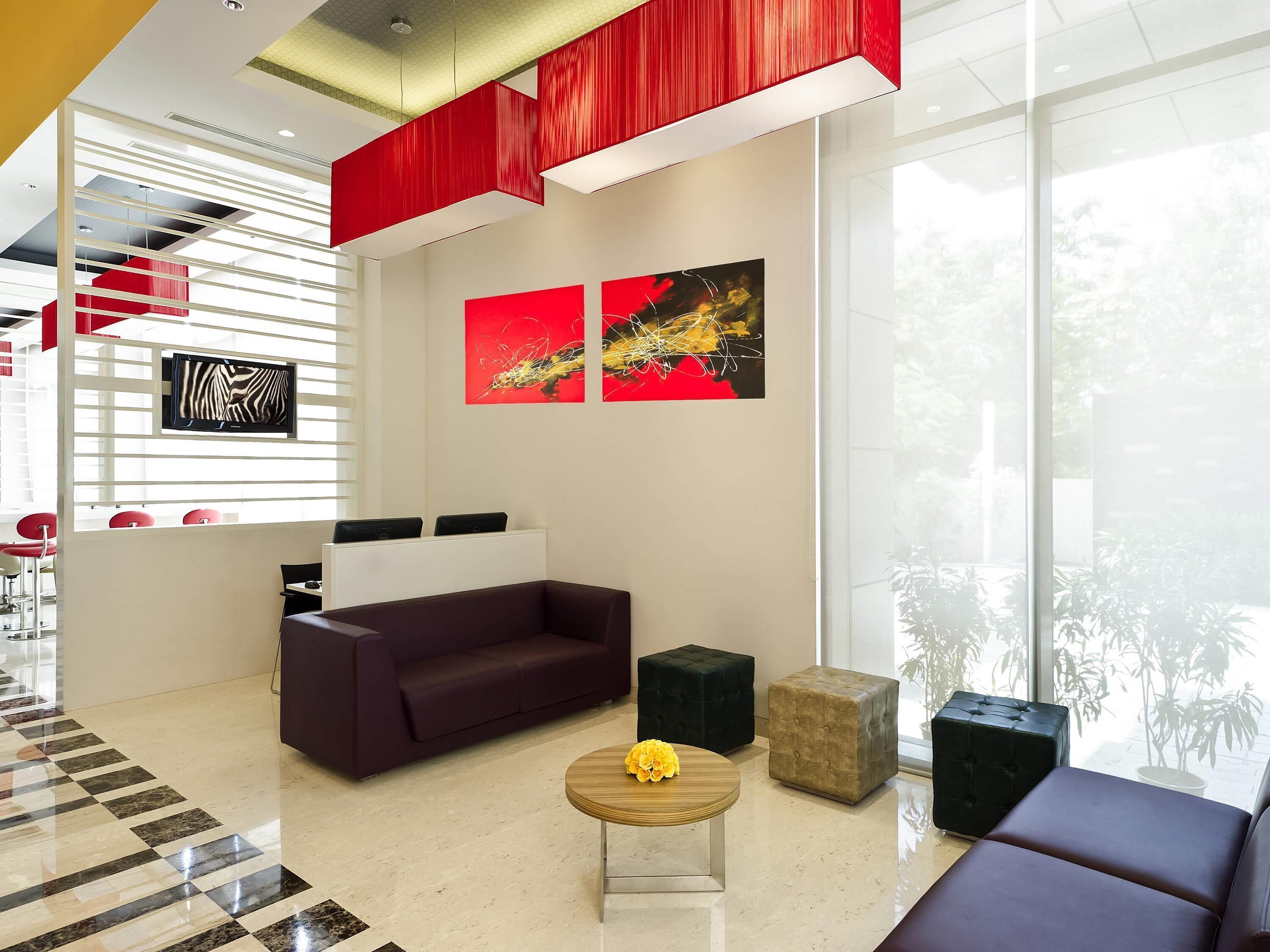 A modern interior with a sofa, coffee table, and artwork on the wall.