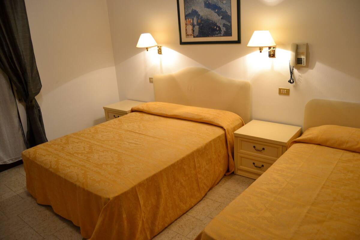 Standard Triple Room | Down comforters, in-room safe, blackout drapes