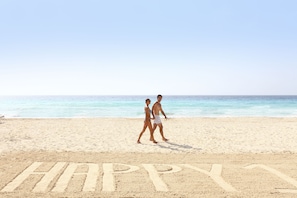 On the beach, white sand, free beach cabanas, sun loungers