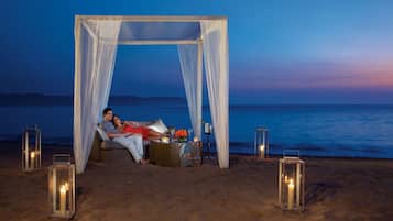 On the beach, sun loungers, beach umbrellas, beach towels