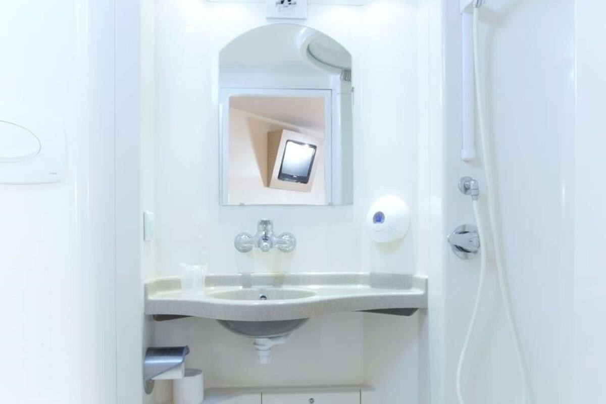 rainfall showerhead, eco-friendly toiletries, towels, toilet paper