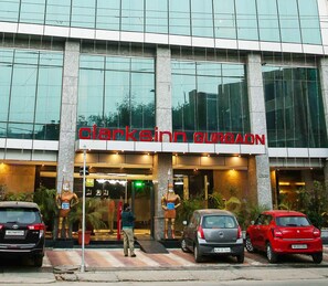 A building with a large glass facade and the sign "Clarkson Gurgaon" above the entrance. - DS Clarks Inn Gurgaon (Gurugram)