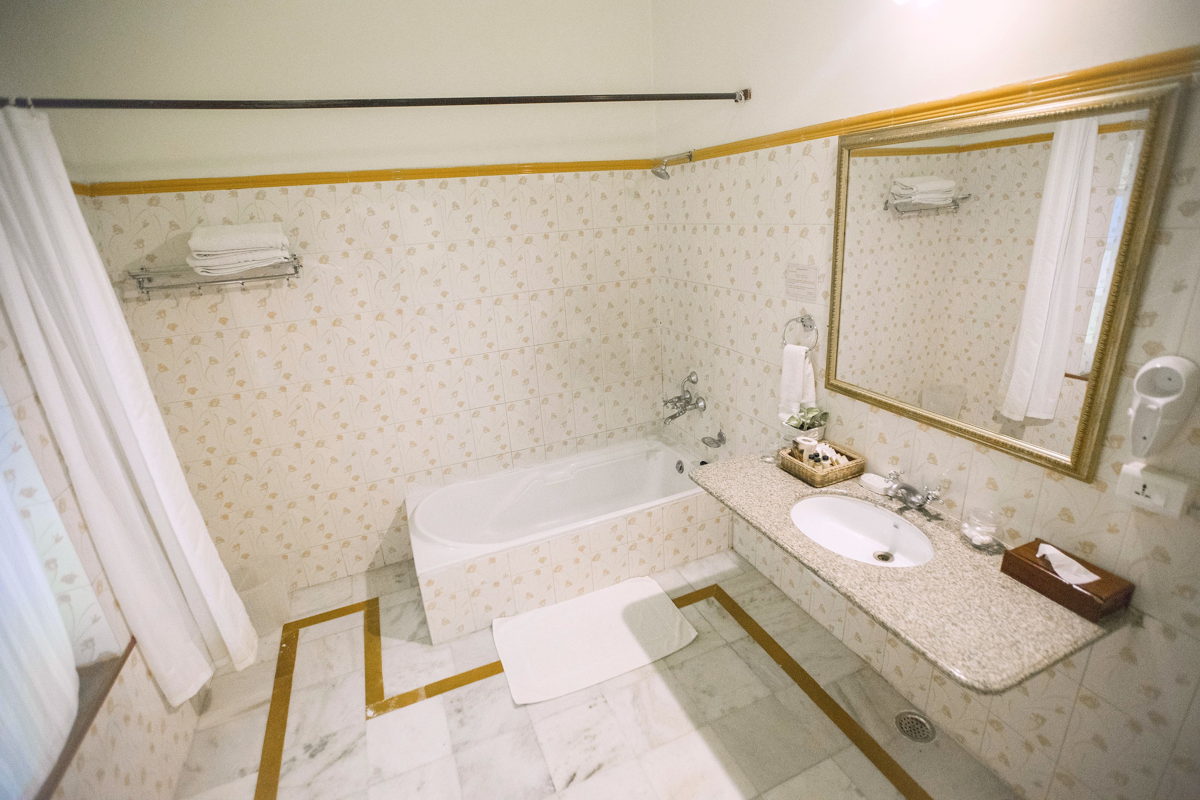 designer toiletries, hair dryer, towels