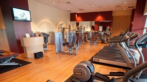 A gym with treadmills, elliptical machines, and weight equipment. - Hotel BM International (Sarajevo)