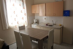 Apartment, Balcony (3 Adults) | Private kitchen | Fridge, coffee/tea maker, electric kettle, cookware/dishes/utensils - Kara Family Apart (Kemer)