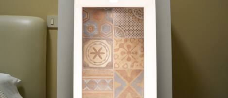A wall with a tiled pattern.