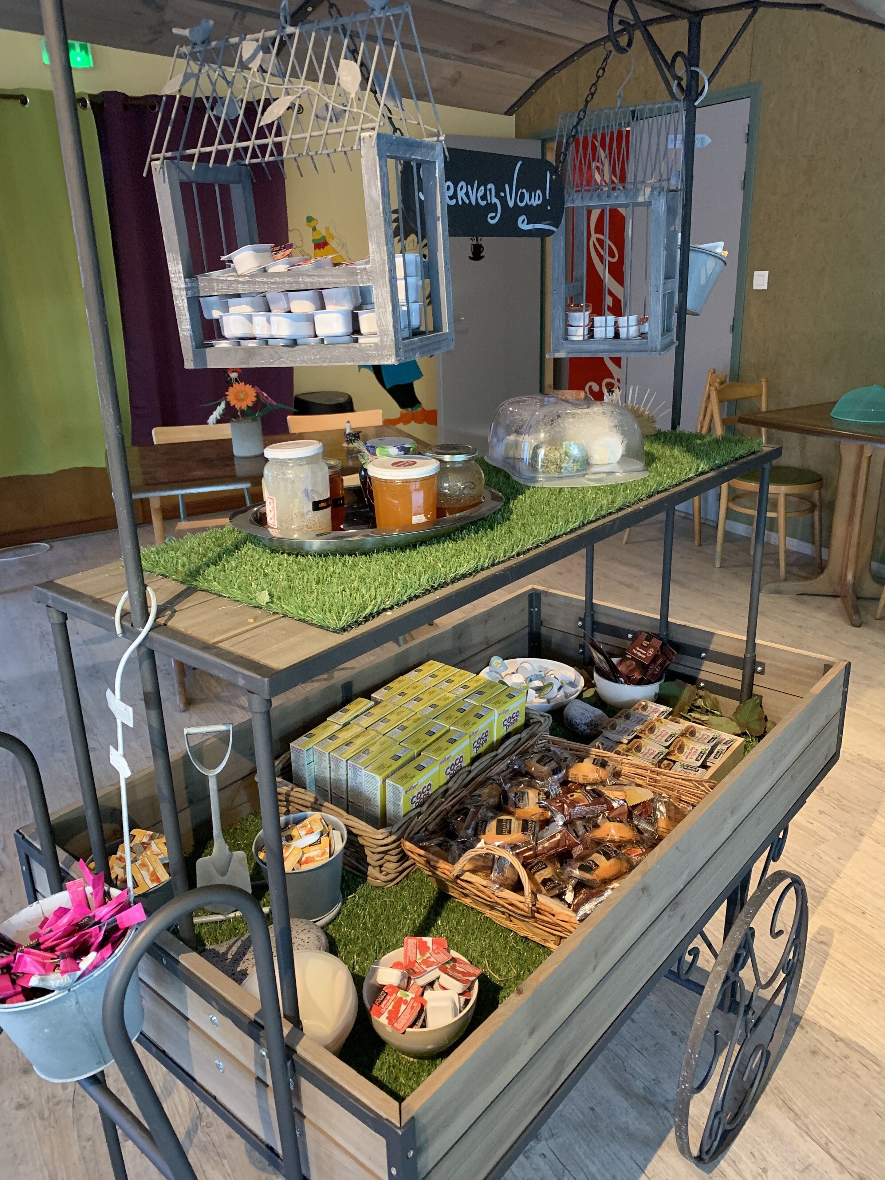 A food cart with various food items and condiments.
