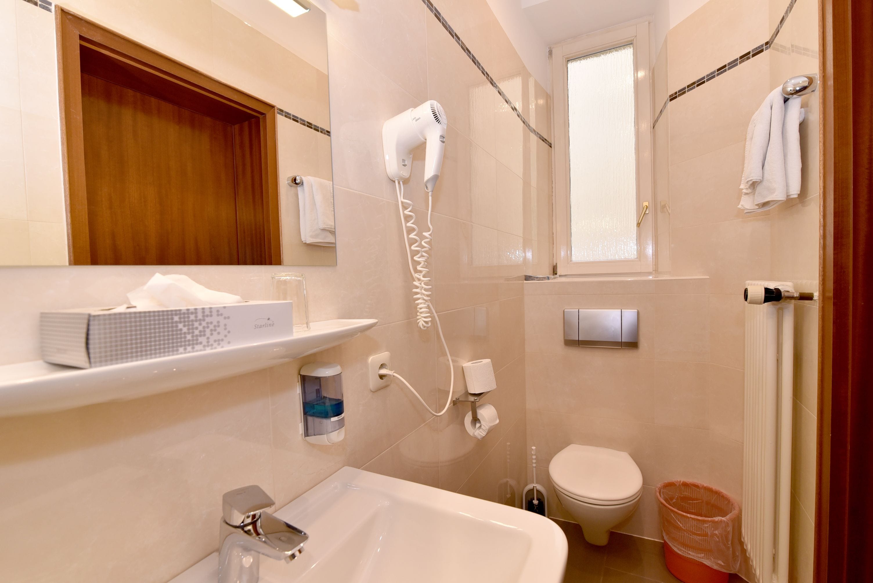 standard single room | bathroom | hair dryer, towels, soap, shampoo