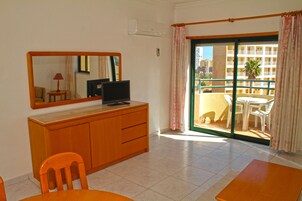 Apartment, 1 Bedroom | Living area | 22-inch TV with satellite channels