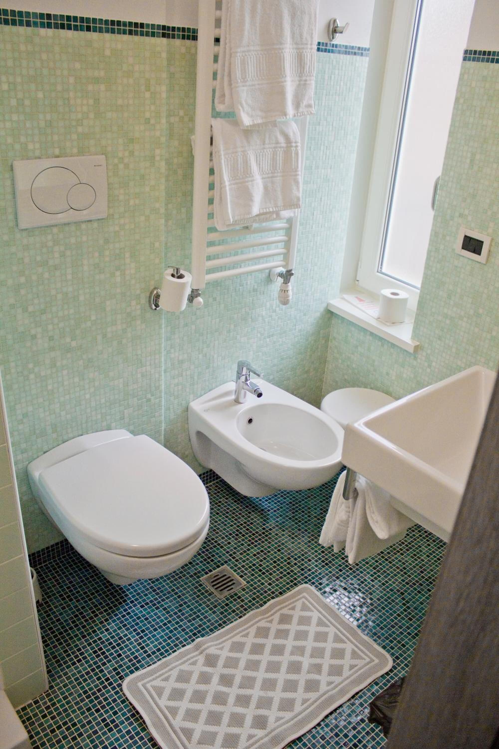 shower, eco-friendly toiletries, hair dryer, towels