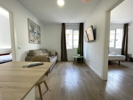 Standard Apartment 2/5 | Living area | 22-inch flat-screen TV with digital channels, TV