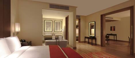 A hotel room with a large bed, a sitting area, a bathroom with a bathtub, and a dining area.