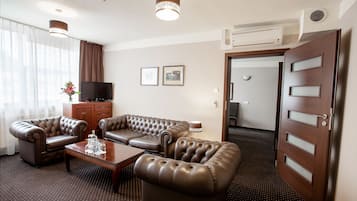 Standard Apartment, 1 King Bed | Living area | 32-inch LCD TV with cable channels, TV