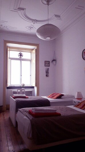 Twin Room, Shared Bathroom | Down comforters, iron/ironing board, free WiFi - Refuge in Santa Marta Hostel (Lisbon)