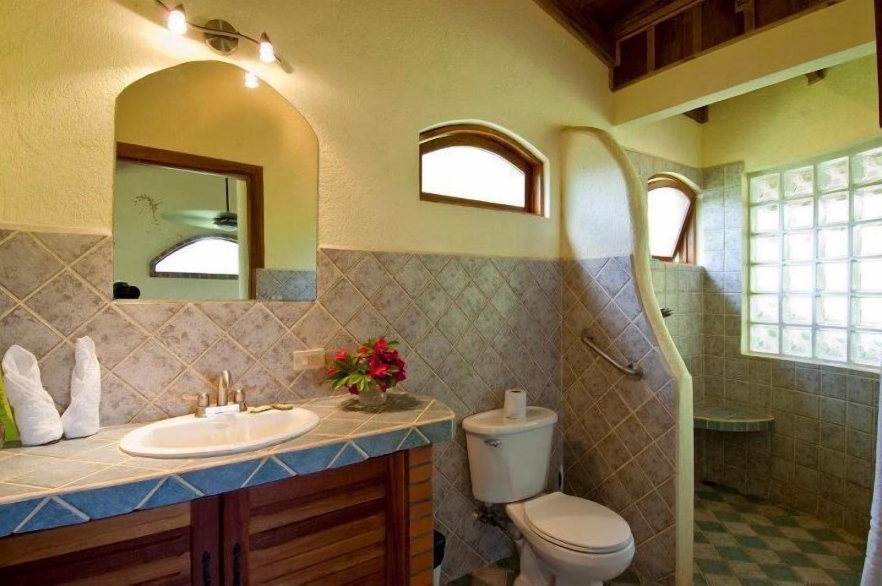 suite, 1 queen bed with sofa bed | bathroom | shower, rainfall showerhead, hair dryer, towels