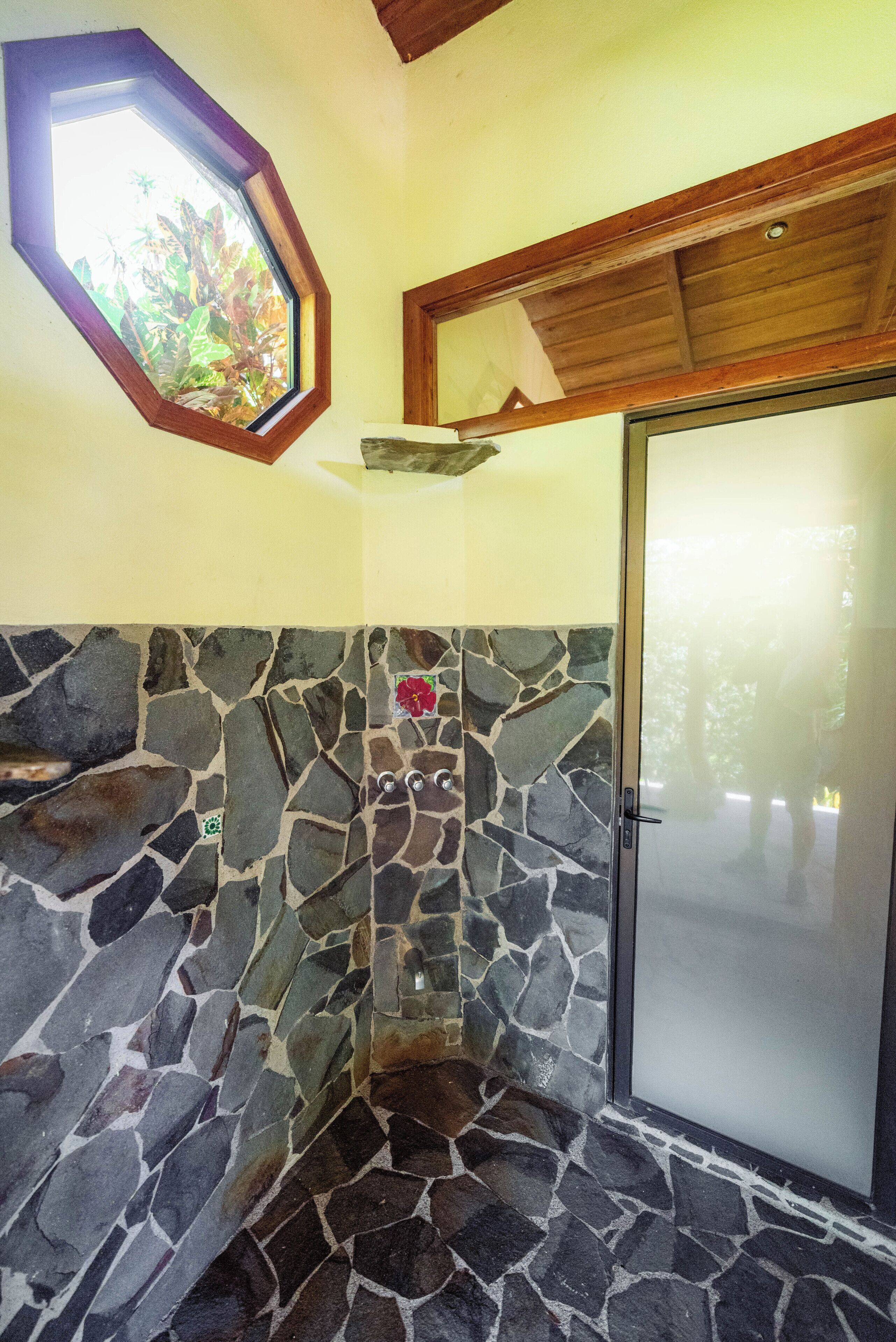 room (jungle) | bathroom | shower, rainfall showerhead, hair dryer, towels