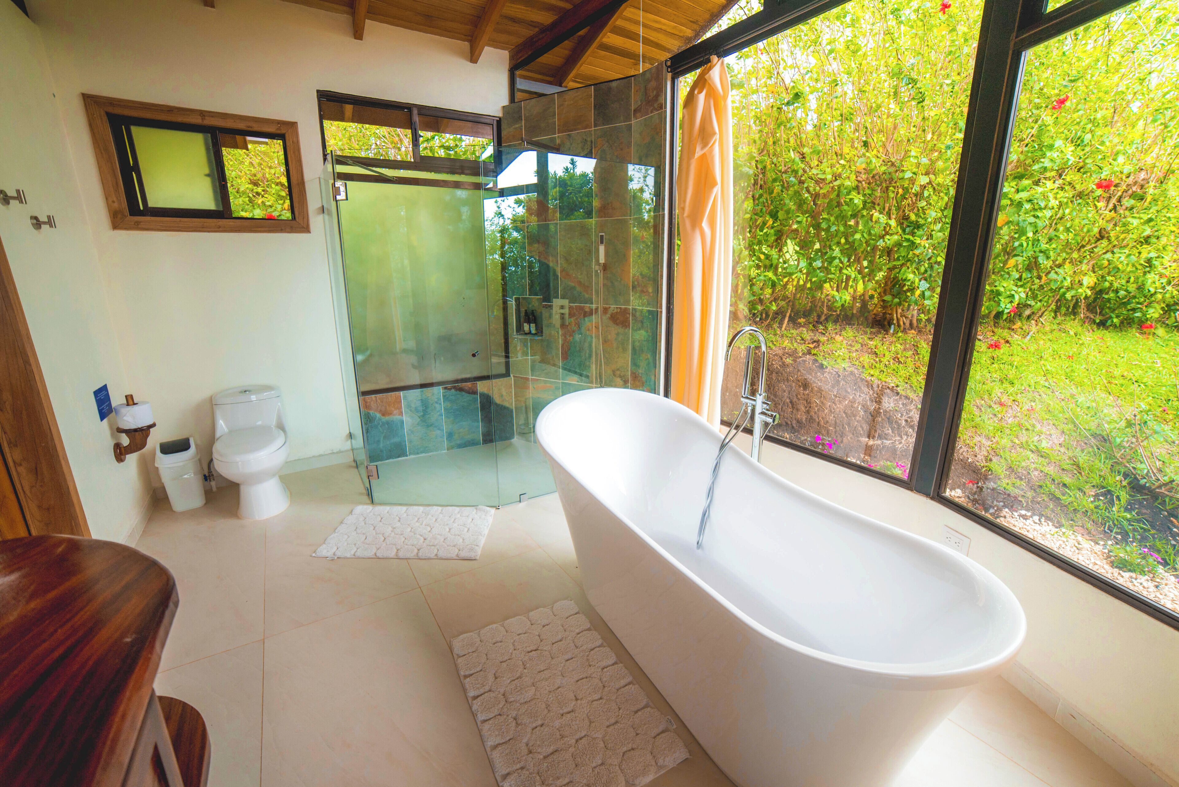 comfort studio suite | bathroom | shower, rainfall showerhead, hair dryer, towels