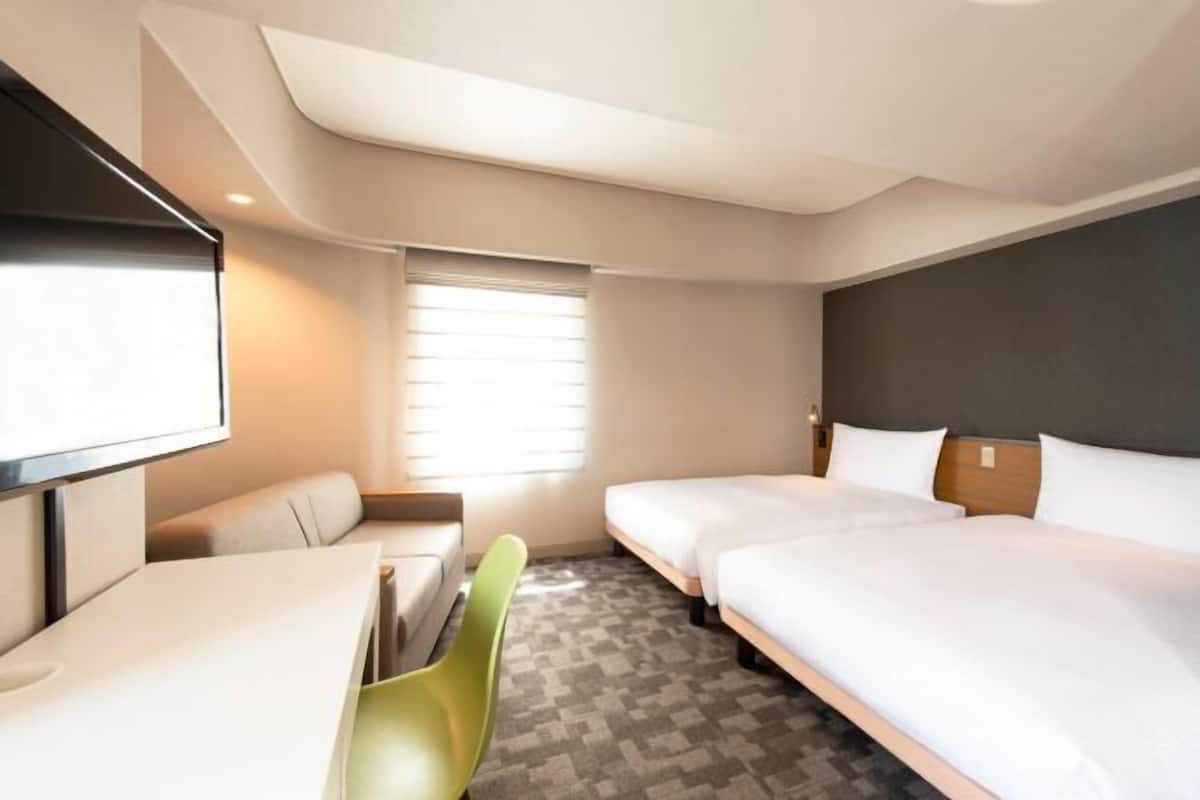 Luxe beddengoed, een kluis op de kamer, een strijkplank/strijkijzer