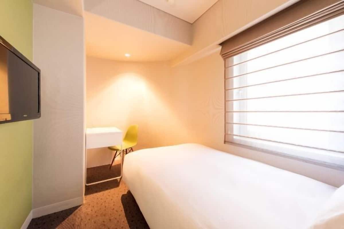 Luxe beddengoed, een kluis op de kamer, een strijkplank/strijkijzer