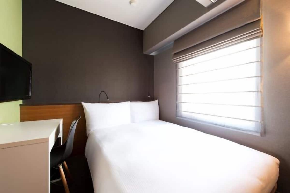 Luxe beddengoed, een kluis op de kamer, een strijkplank/strijkijzer