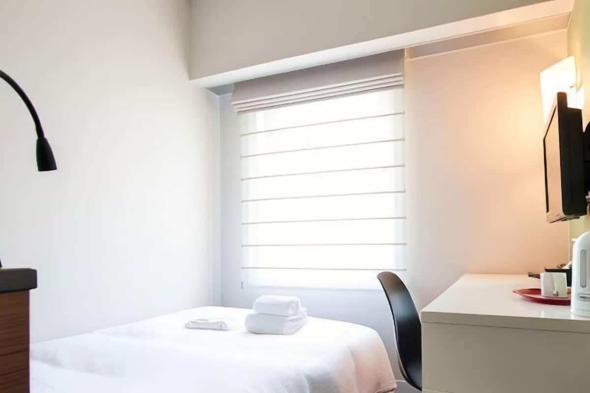 Luxe beddengoed, een kluis op de kamer, een strijkplank/strijkijzer