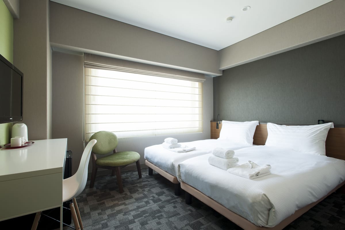 Luxe beddengoed, een kluis op de kamer, een strijkplank/strijkijzer