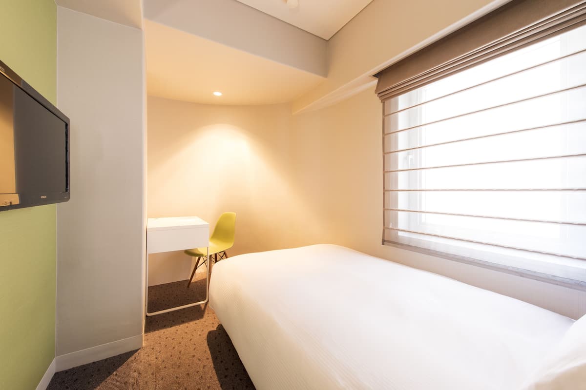 Luxe beddengoed, een kluis op de kamer, een strijkplank/strijkijzer