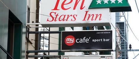 A building with signs for 'Ten Stars Inn' and 'Delich Restaurant'.